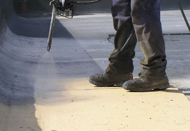 Coating systems over Quebec spray foam roof systems